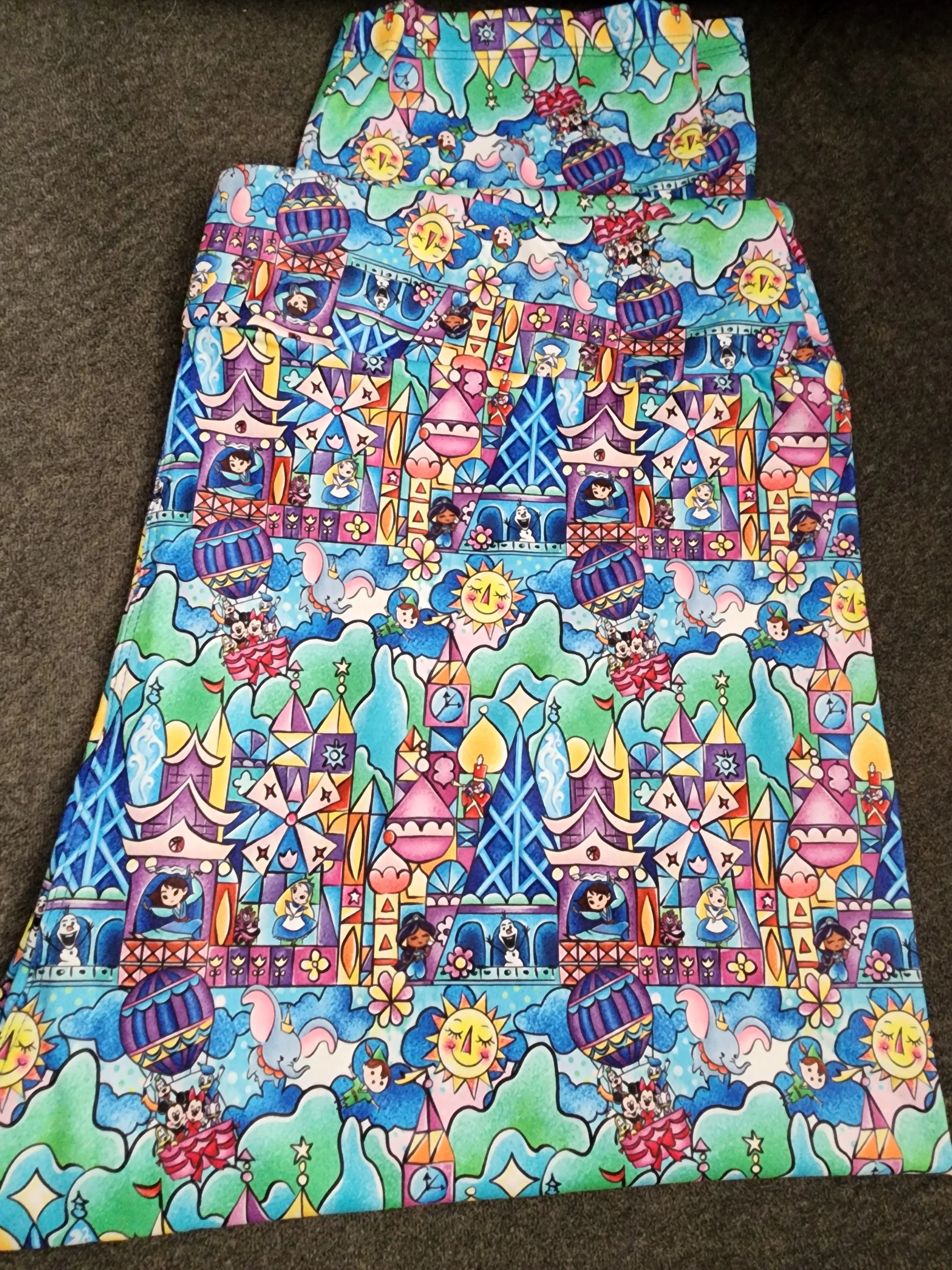 CP Disney It's a Small World Movie Characters Capri Leggings