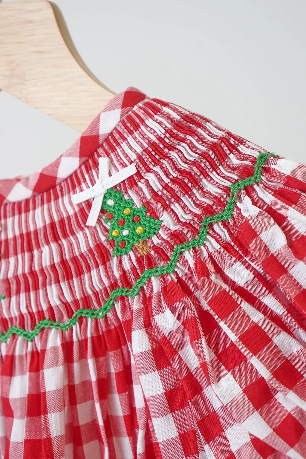 Red christmas tree hand smocked gingham romper